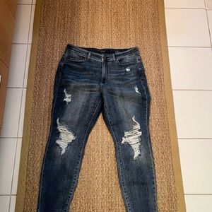 Never worn. Very stretchy boyfriend cut distressed jeans.